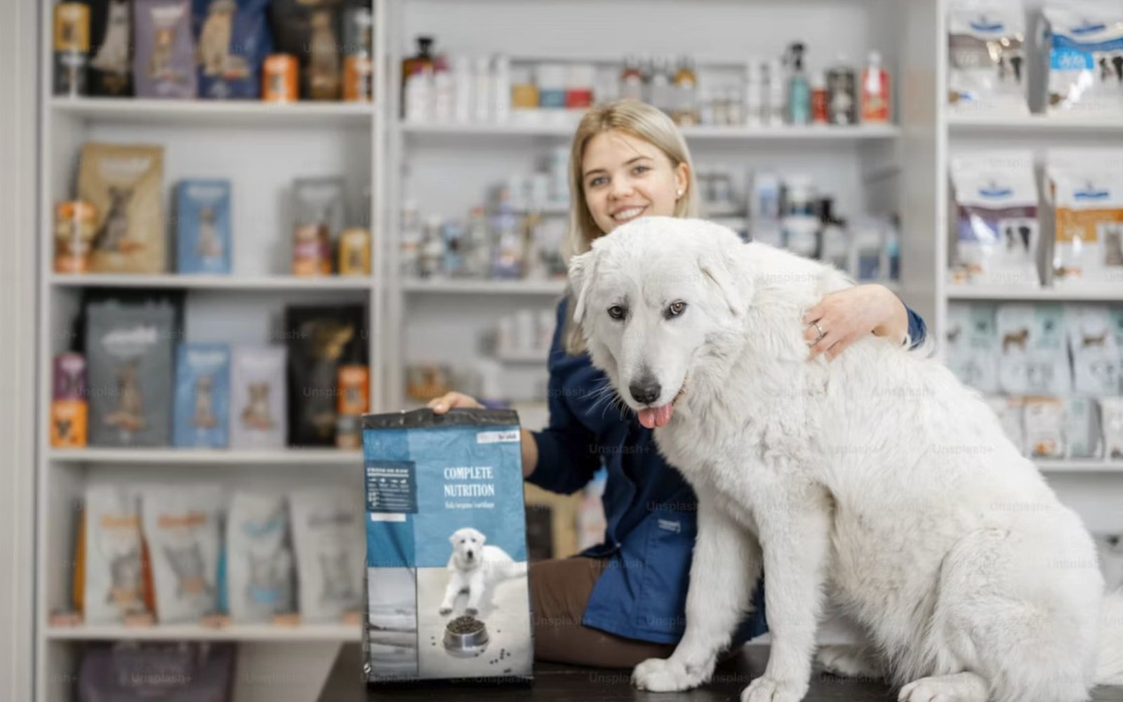 Pet care assistant with a dog beside pet healthcare products